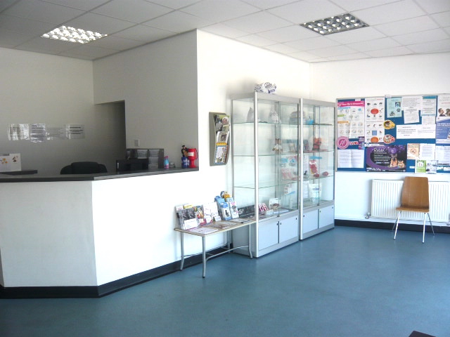 A reception desk in a white room